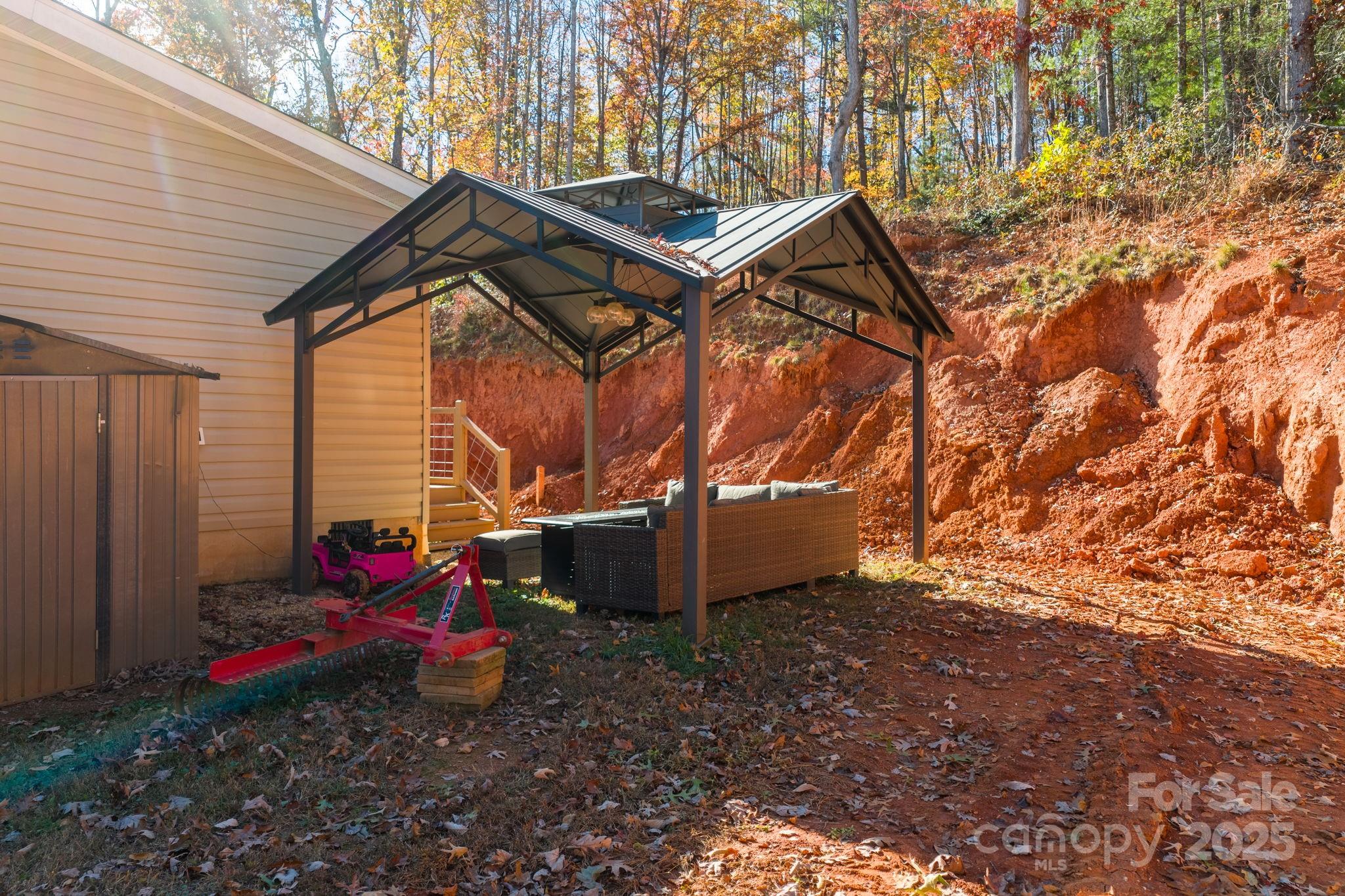 2603 Setzers Gap Road Lenoir, NC 28645 - Photo 23 of 29 a backyard of a house with seating space