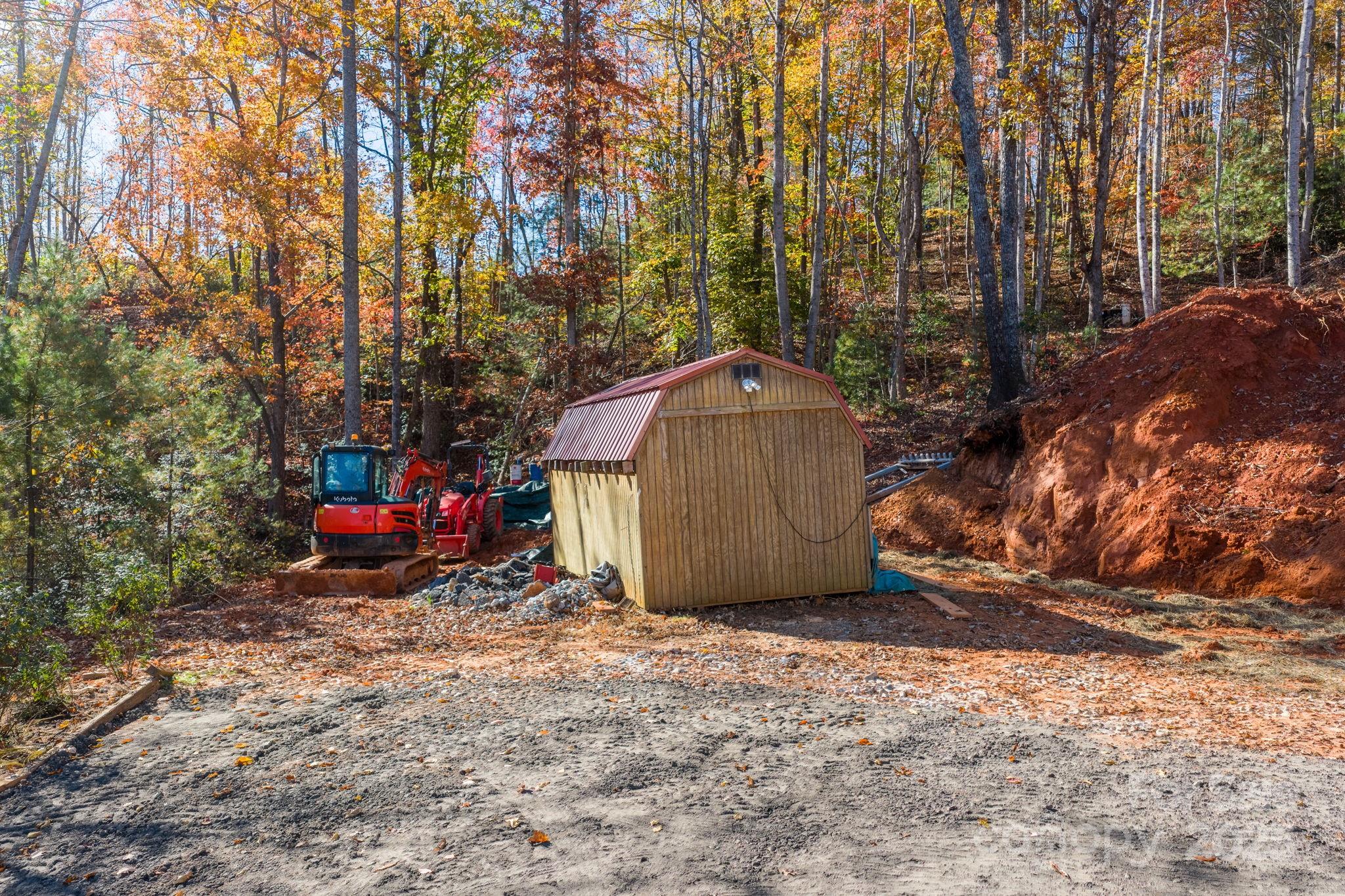 2603 Setzers Gap Road Lenoir, NC 28645 - Photo 24 of 29 a view of a barn in the middle of a yard