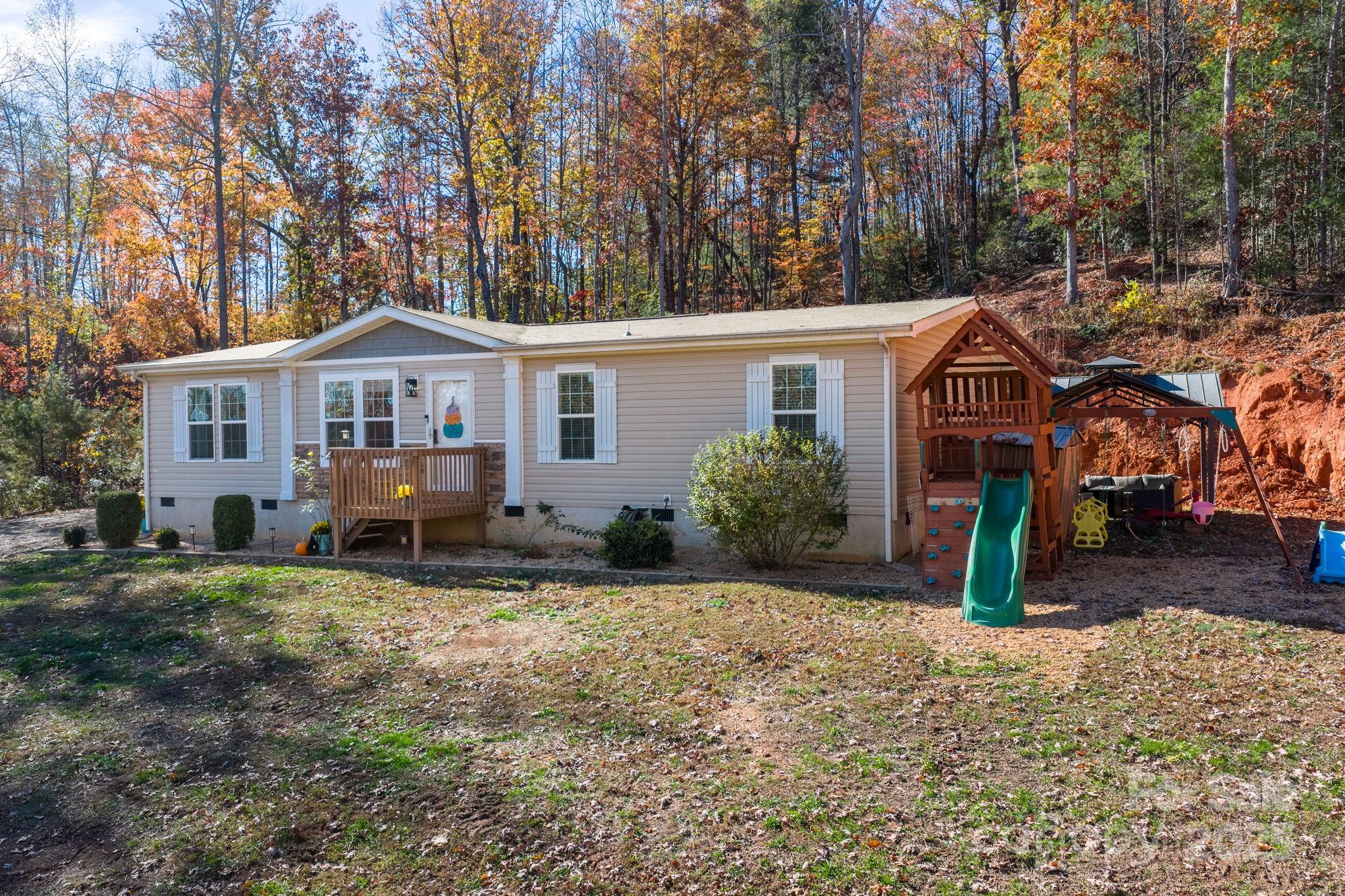 2603 Setzers Gap Road Lenoir, NC 28645 - Photo 4 of 29 front view of a house with a yard