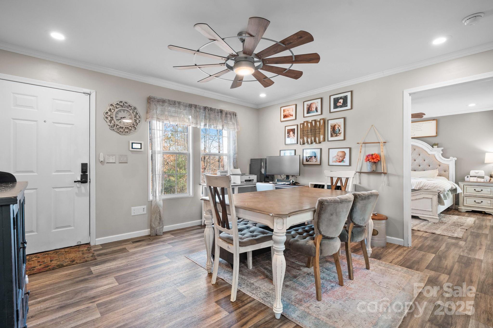 2603 Setzers Gap Road Lenoir, NC 28645 - Photo 5 of 29 a view of a dining room with furniture window and wooden floor