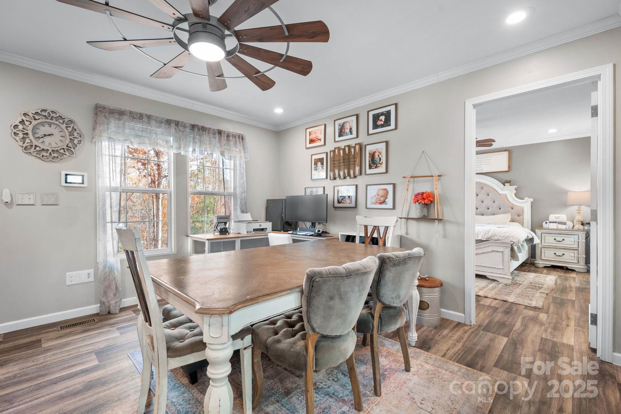 2603 Setzers Gap Road Lenoir, NC 28645 - Photo 6 of 29 a view of a dining room with furniture window and wooden floor
