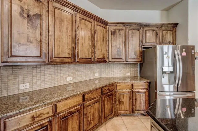 a kitchen with stainless steel appliances a refrigerator and a sink