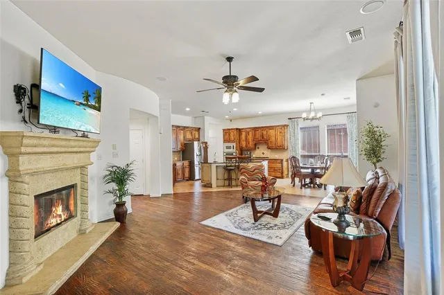 a living room with furniture fireplace and a fireplace