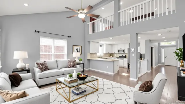 a living room with furniture and a chandelier