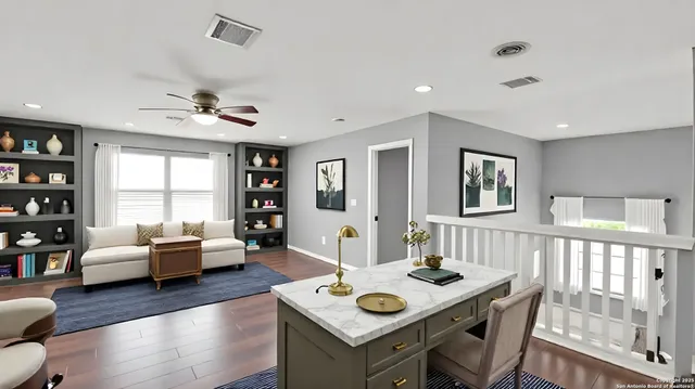 a living room with furniture and wooden floor