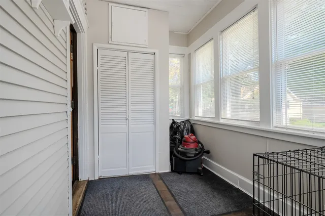 a view of a room that has a bed and a window
