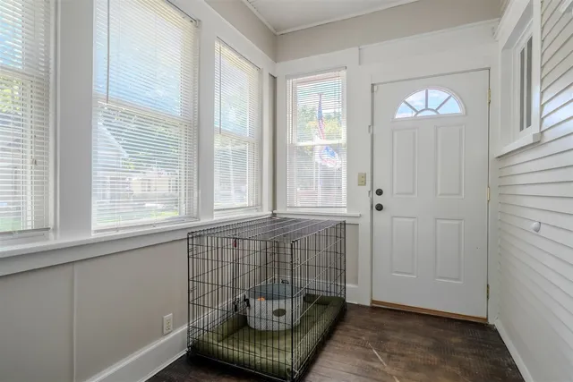 a view of front door with workspace