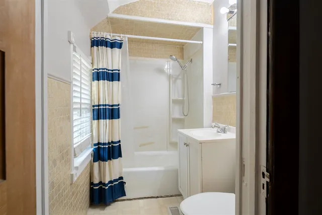 a bathroom with a toilet sink and bathtub