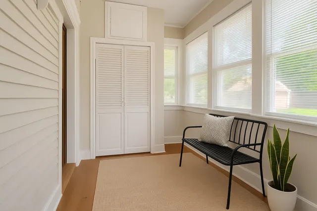 a backyard of a house with outdoor seating