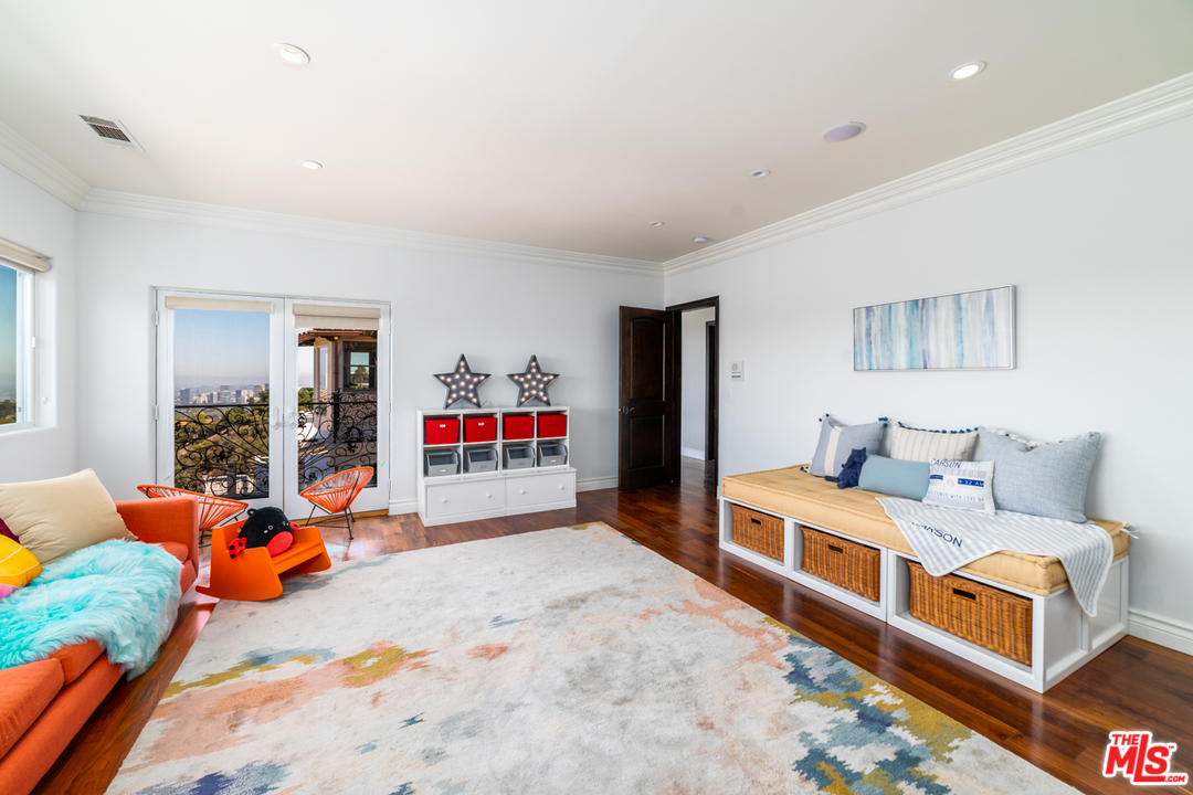 1236 Stradella Road Los Angeles, CA 90077 - Photo 16 of 26 a bed room with a bed and a couch