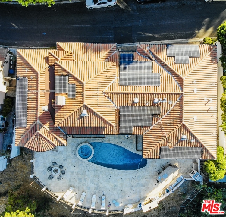 1236 Stradella Road Los Angeles, CA 90077 - Photo 3 of 26 a view of a balcony with a potted plant