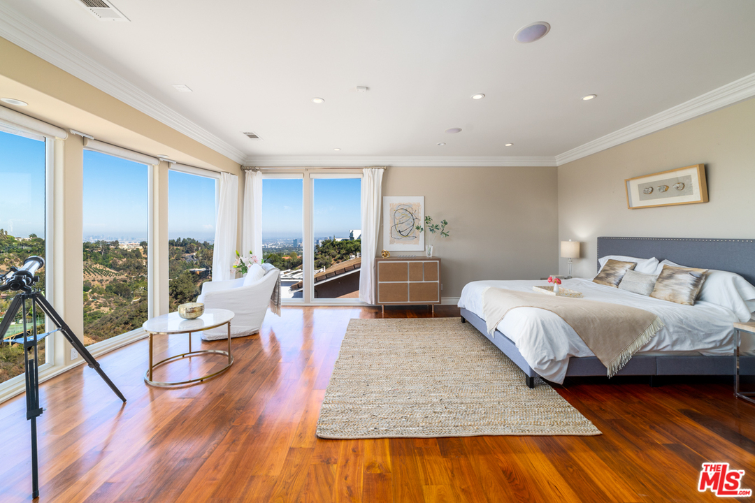 1236 Stradella Road Los Angeles, CA 90077 - Photo 23 of 26 a living room with furniture and a wooden floor