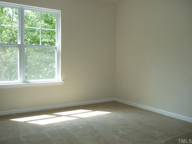 2904 Casona Way Raleigh, NC 27616 - Photo 7 of 12 an empty room with a window