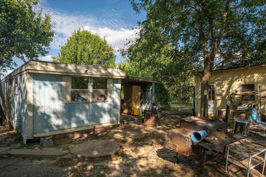 814 Signal Road Quinlan, TX 75474 - Photo 13 of 20 a view of a house with backyard
