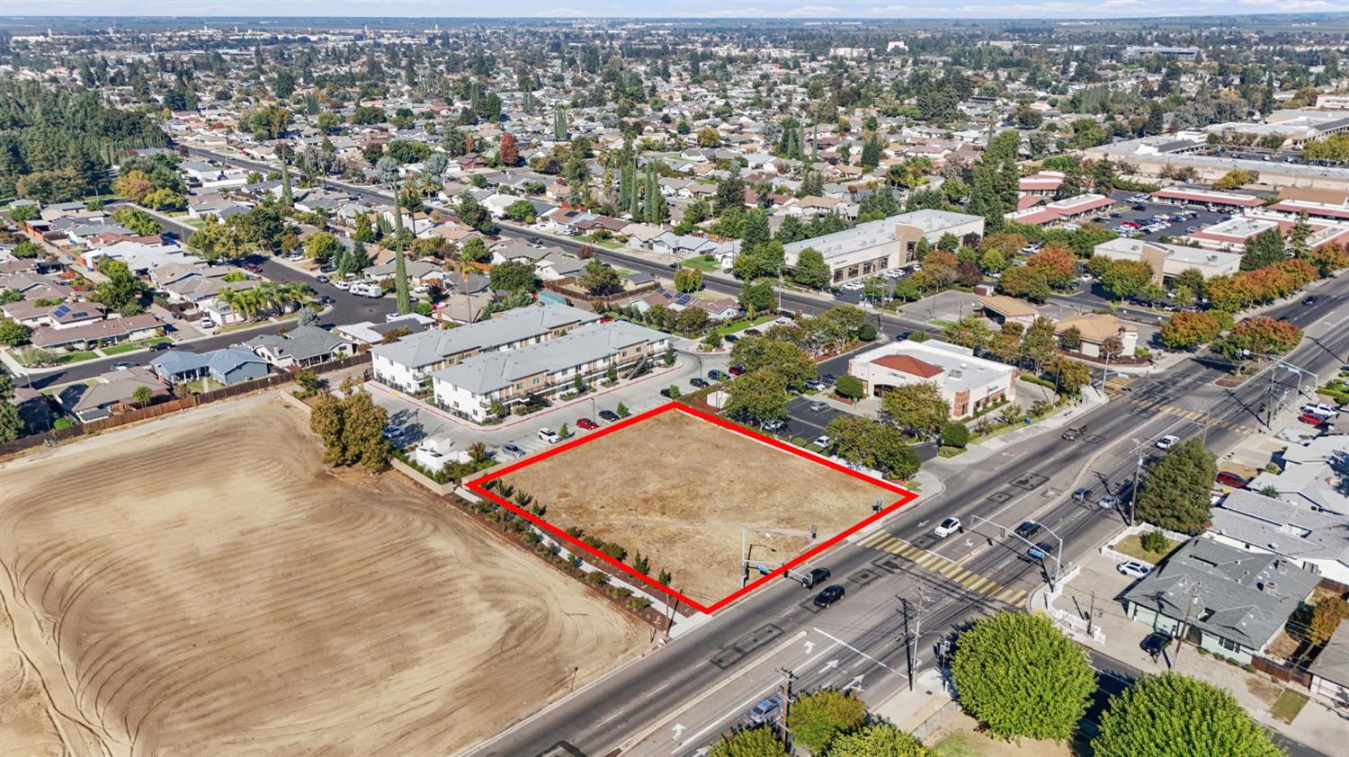 1901 Geer Road Turlock, CA 95382 - Photo 6 of 7 an aerial view of a tennis ground and a large parking space