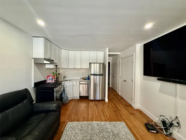 a living room with furniture and a rug