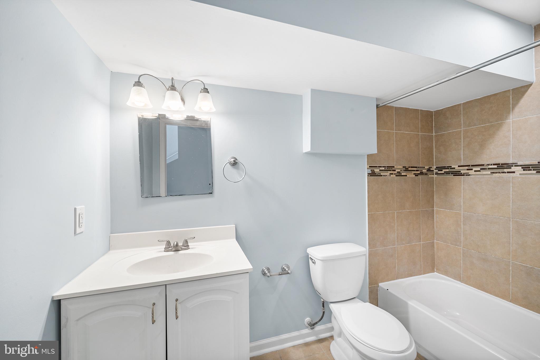 1904 Manton Street Philadelphia, PA 19146 - Photo 18 of 31 a bathroom with a sink toilet a mirror and shower