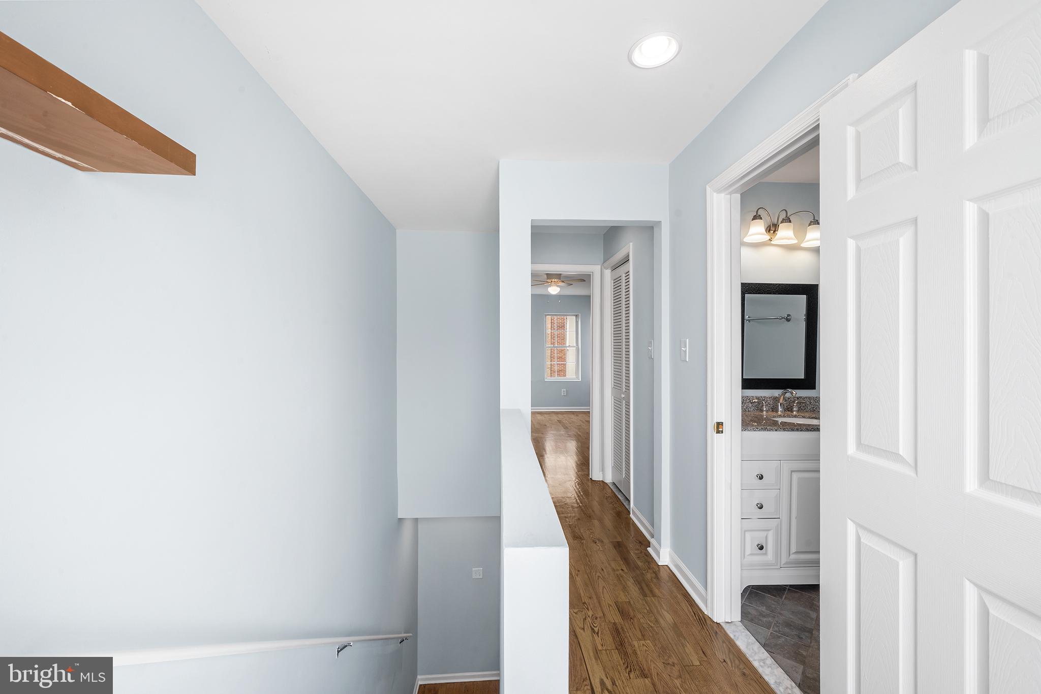 1904 Manton Street Philadelphia, PA 19146 - Photo 20 of 31 a view of a hallway with wooden floor and staircase