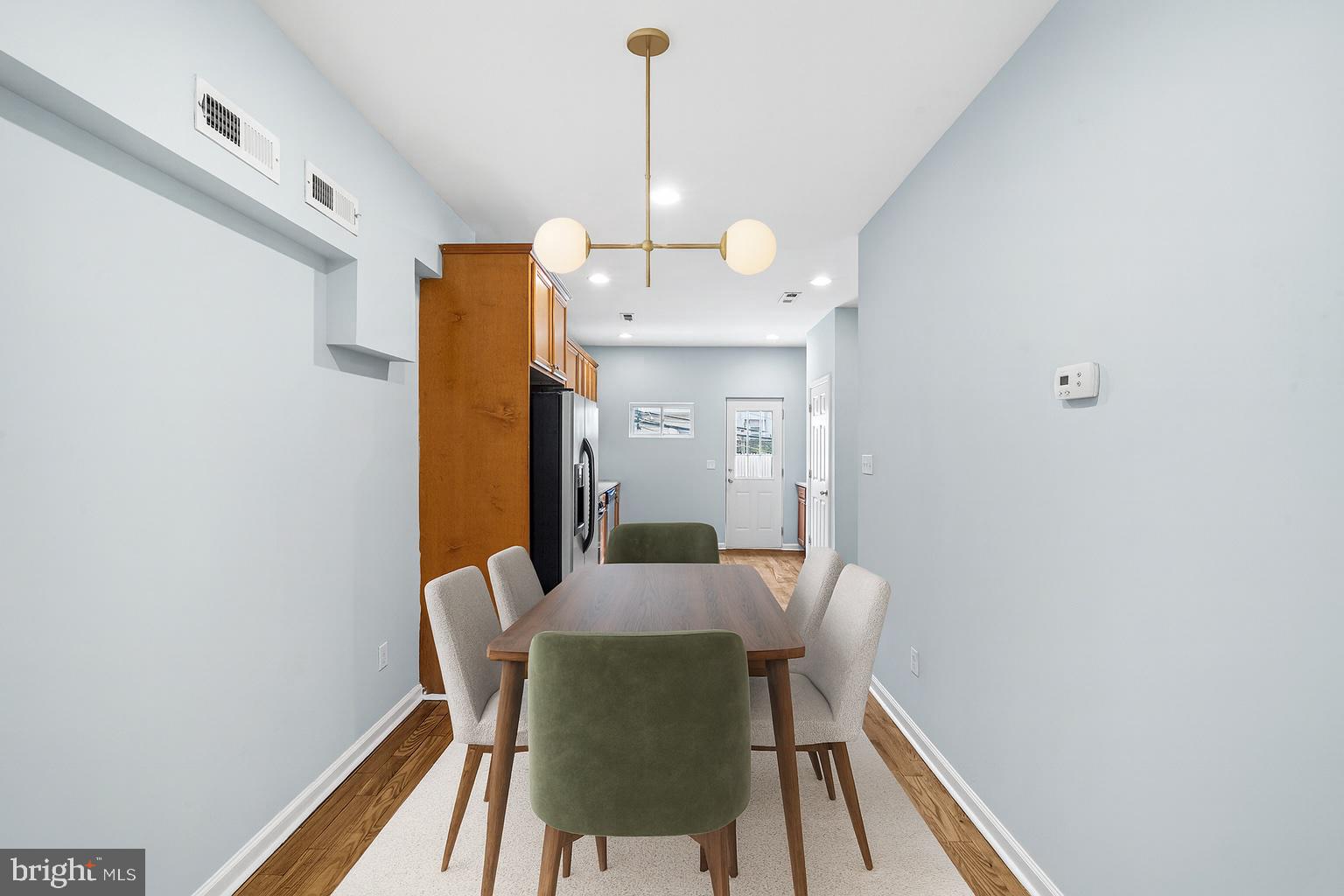 1904 Manton Street Philadelphia, PA 19146 - Photo 2 of 31 a view of a dining room with furniture and wooden floor