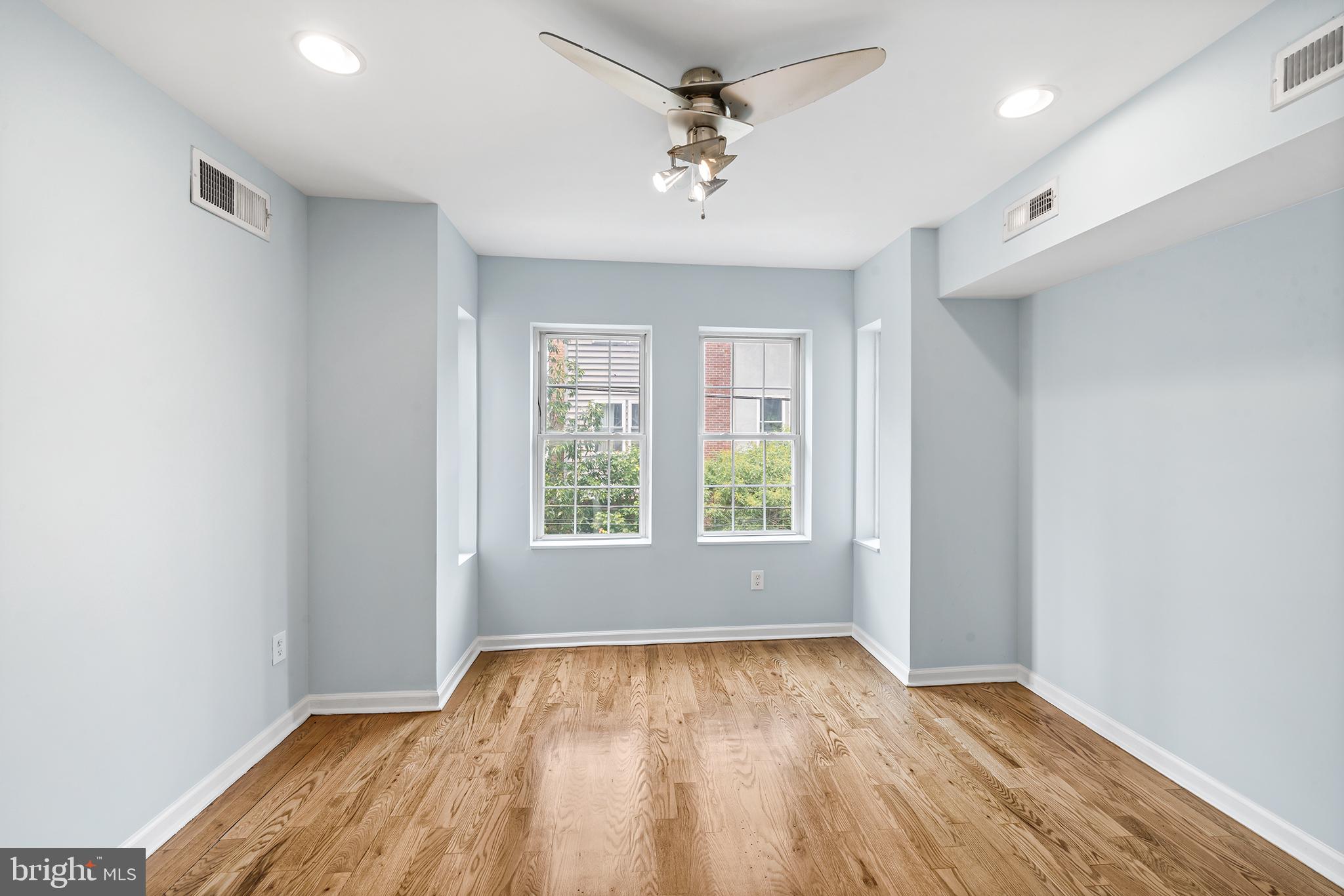 1904 Manton Street Philadelphia, PA 19146 - Photo 21 of 31 wooden floor in an empty room with a window