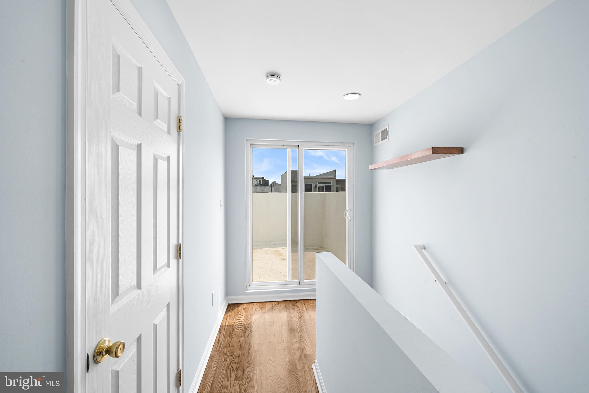 1904 Manton Street Philadelphia, PA 19146 - Photo 25 of 31 a view of hallway with wooden floor and cabinet