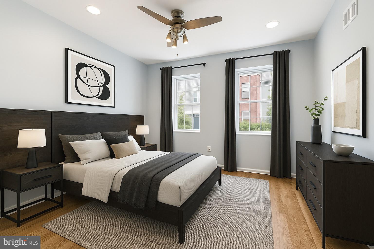 1904 Manton Street Philadelphia, PA 19146 - Photo 7 of 31 a bedroom with a bed and a chandelier