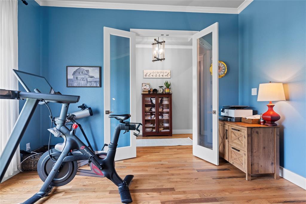 1024 Henry Way Springtown, TX 76082 - Photo 7 of 29 Hardwood flooring throughout featuring French doors with glass panels