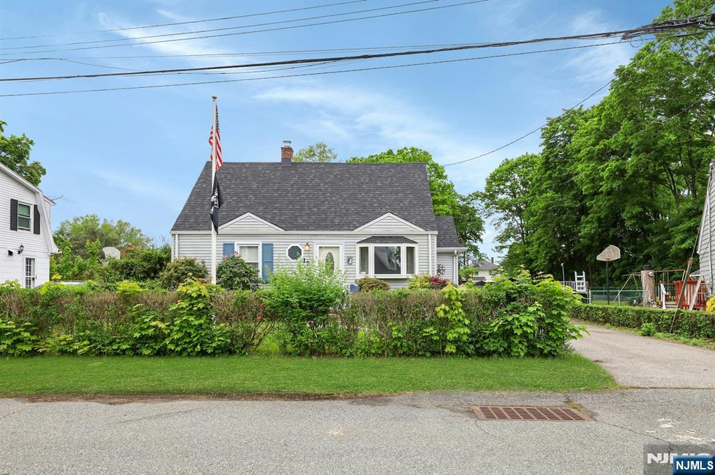 17 Butler Place Wanaque, NJ 07420 - Photo 1 of 28 a view of a house with a yard and plants