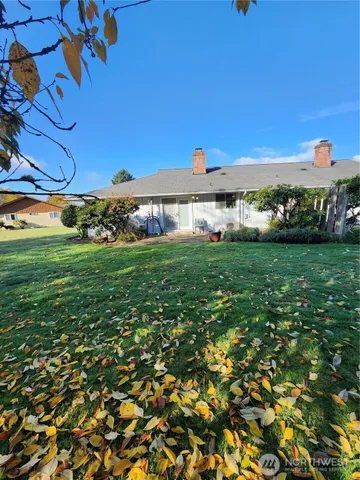 a view of a big room with wooden floor and city view