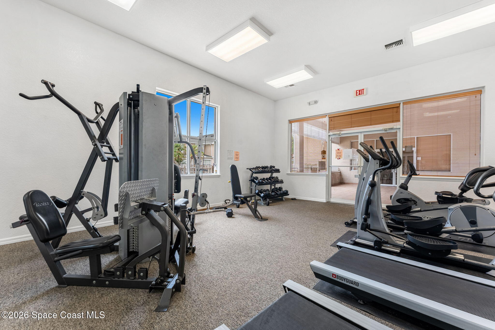 110 Turpial Way, Unit 106 Melbourne, FL 32901 - Photo 41 of 50 a view of a room with gym equipment