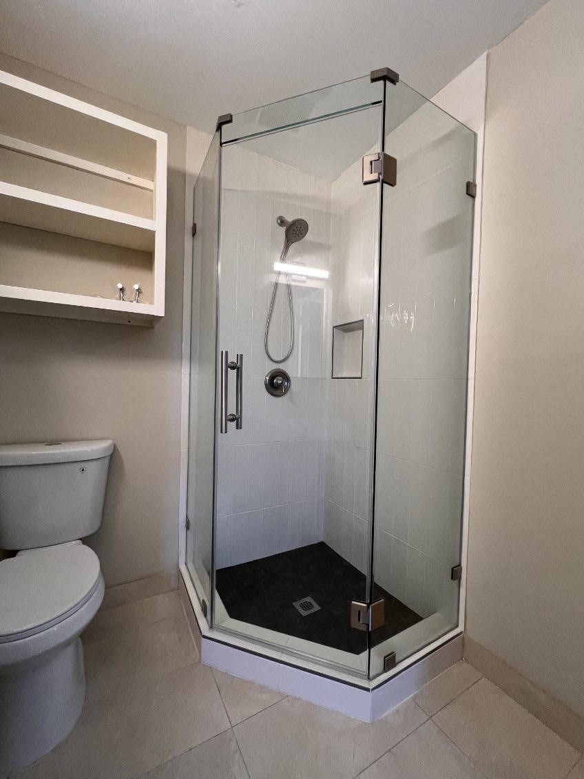 5834 Indigo Street Houston, TX 77074 - Photo 12 of 15 a bathroom with a toilet and a shower