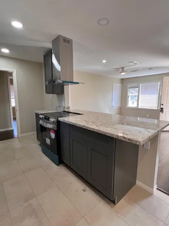 a kitchen with a sink and a stove