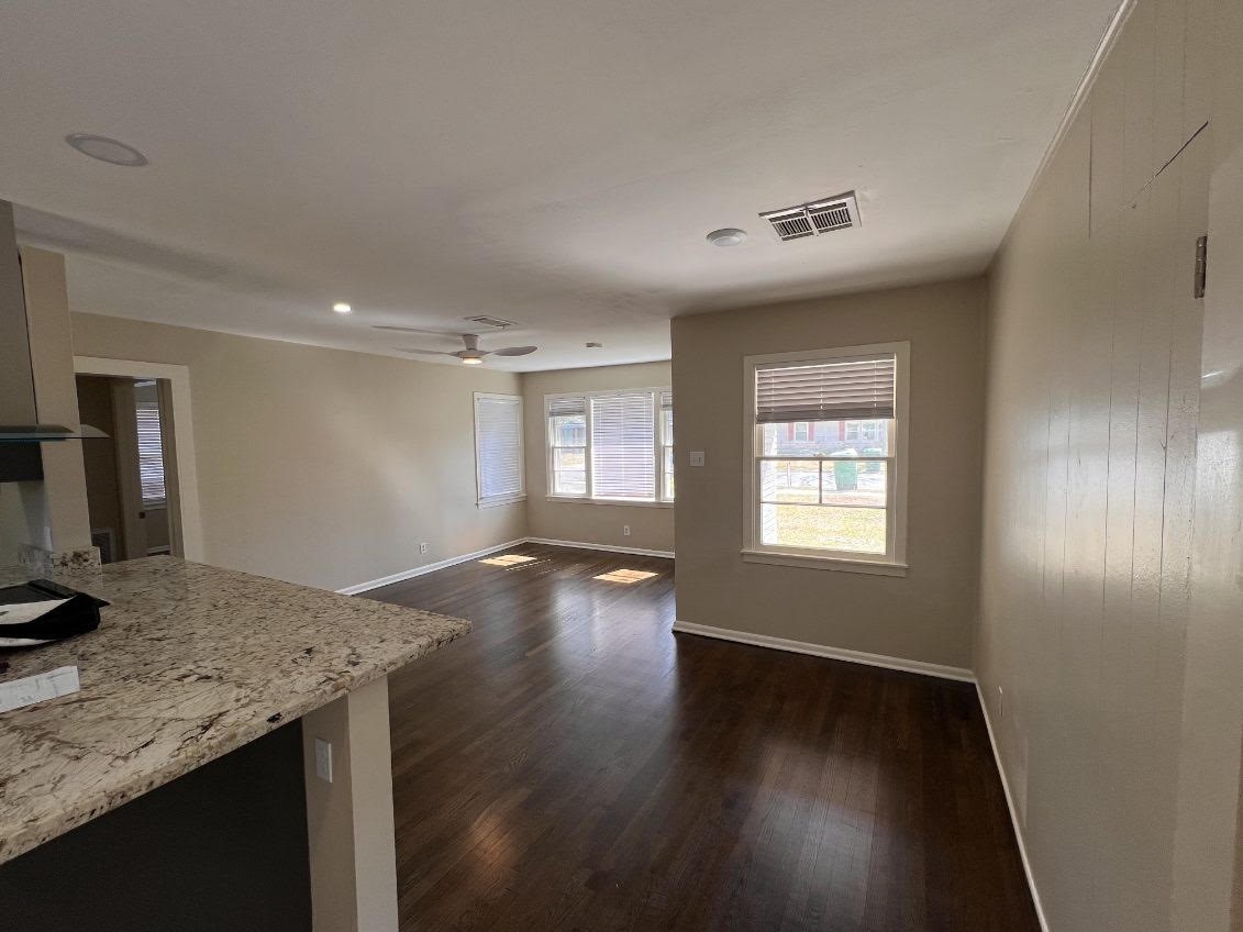 5834 Indigo Street Houston, TX 77074 - Photo 3 of 15 a view of a kitchen cabinets a stove and wooden floor