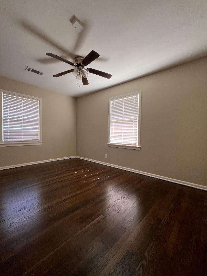 5834 Indigo Street Houston, TX 77074 - Photo 5 of 15 a view of an empty room with wooden floor and a window
