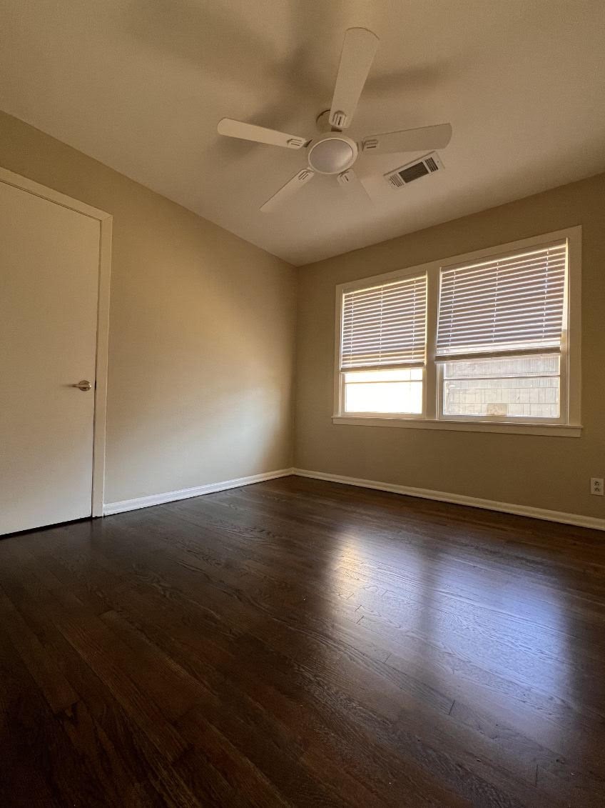5834 Indigo Street Houston, TX 77074 - Photo 6 of 15 an empty room with wooden floor and windows