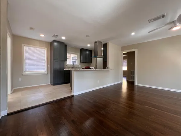 a view of kitchen with cabinets and wooden floor