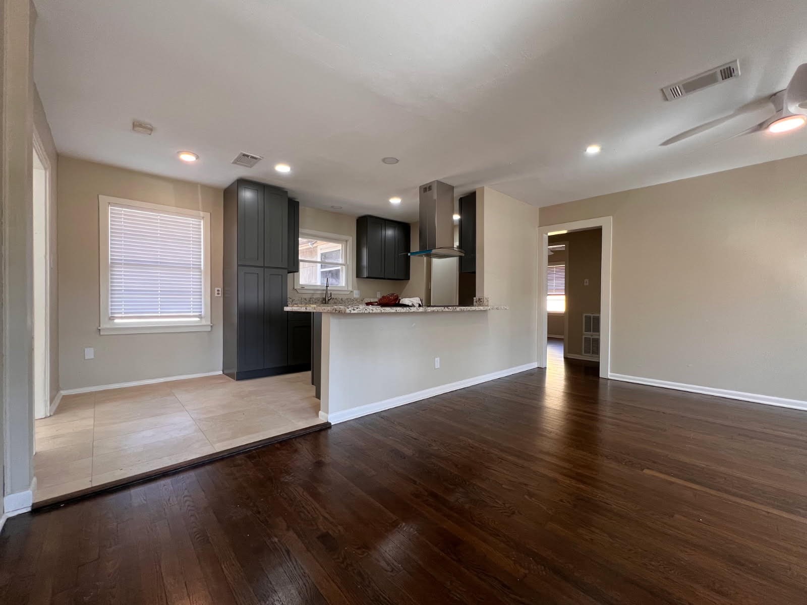 5834 Indigo Street Houston, TX 77074 - Photo 10 of 15 a view of kitchen with cabinets and wooden floor