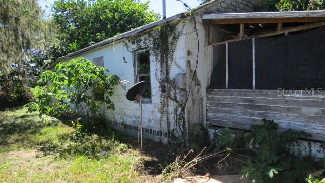 37236 Rose Avenue Dade City, FL 33523 - Photo 3 of 3 a backyard of a house with lots of green space
