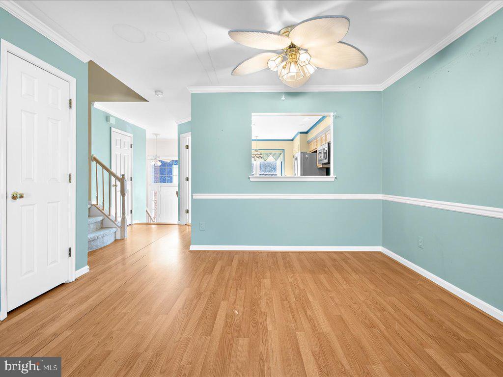 266 St Michaels Circle Odenton, MD 21113 - Photo 14 of 42 a view of an empty room with wooden floor and a window