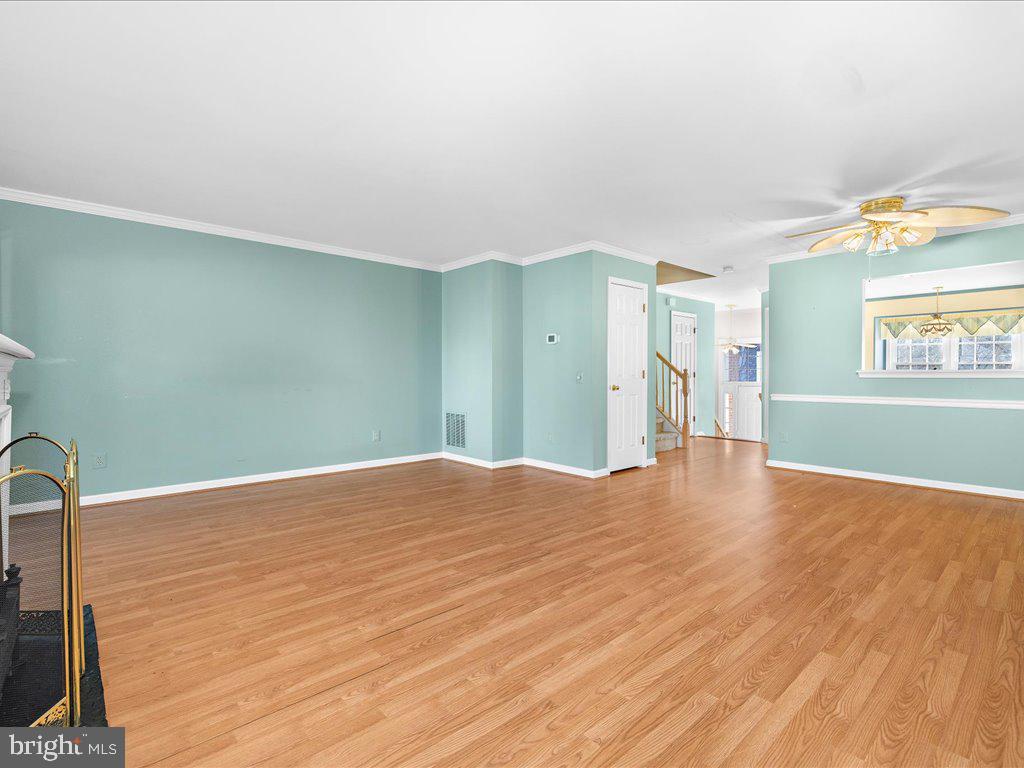 266 St Michaels Circle Odenton, MD 21113 - Photo 16 of 42 a view of a livingroom with wooden floor and a window
