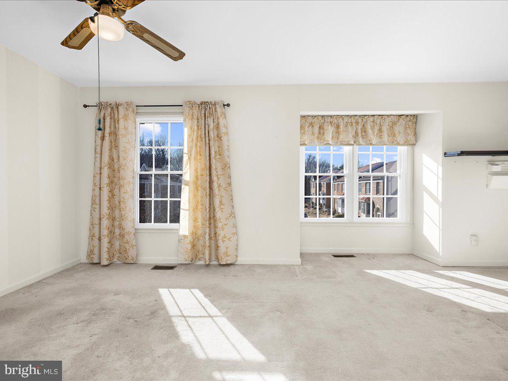 266 St Michaels Circle Odenton, MD 21113 - Photo 23 of 42 an empty room with windows and fan