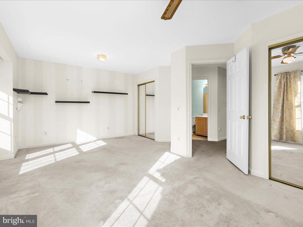 266 St Michaels Circle Odenton, MD 21113 - Photo 24 of 42 an empty room with kitchen view and windows