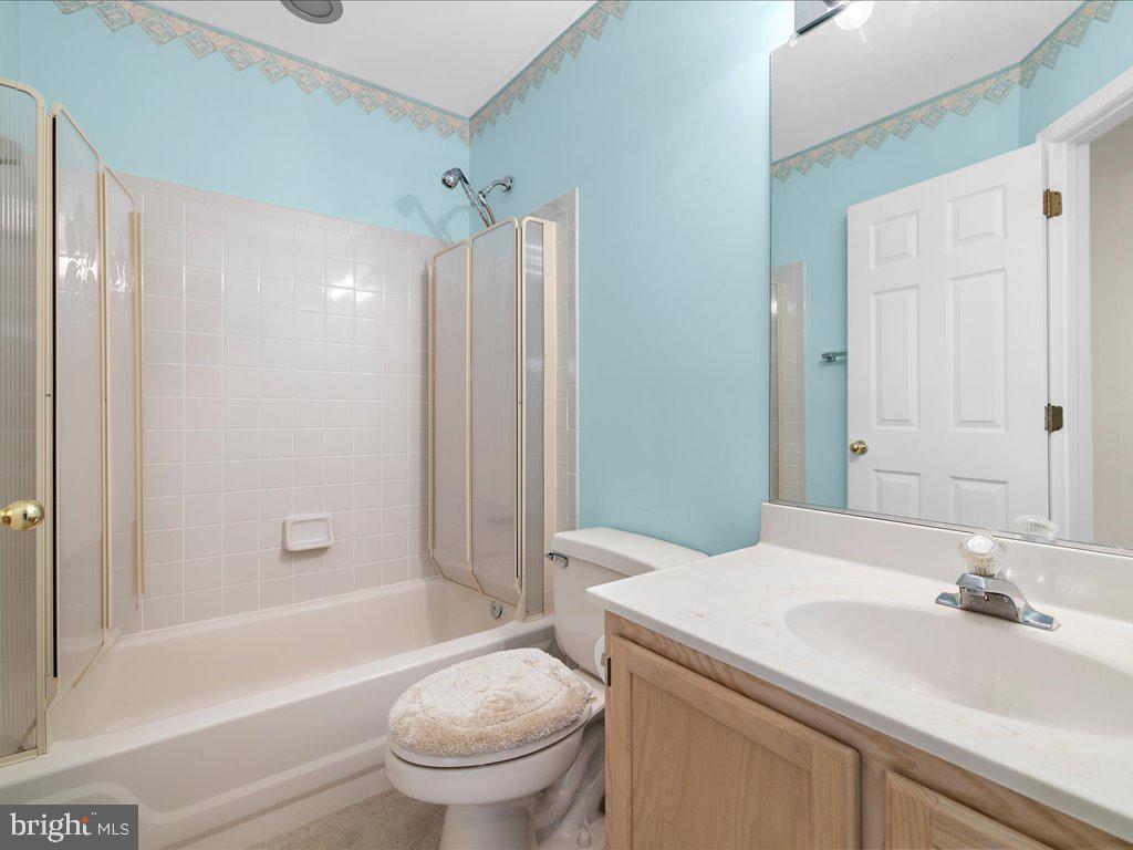 266 St Michaels Circle Odenton, MD 21113 - Photo 28 of 42 a bathroom with a sink a toilet and shower