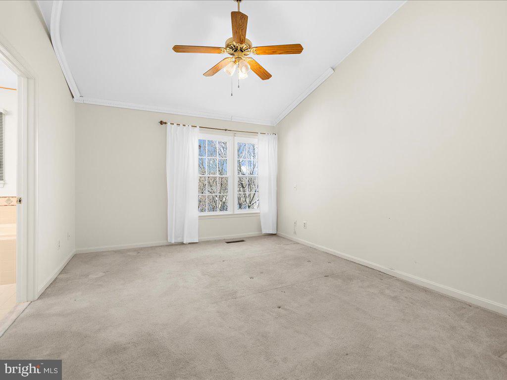 266 St Michaels Circle Odenton, MD 21113 - Photo 29 of 42 an empty room with windows and fan