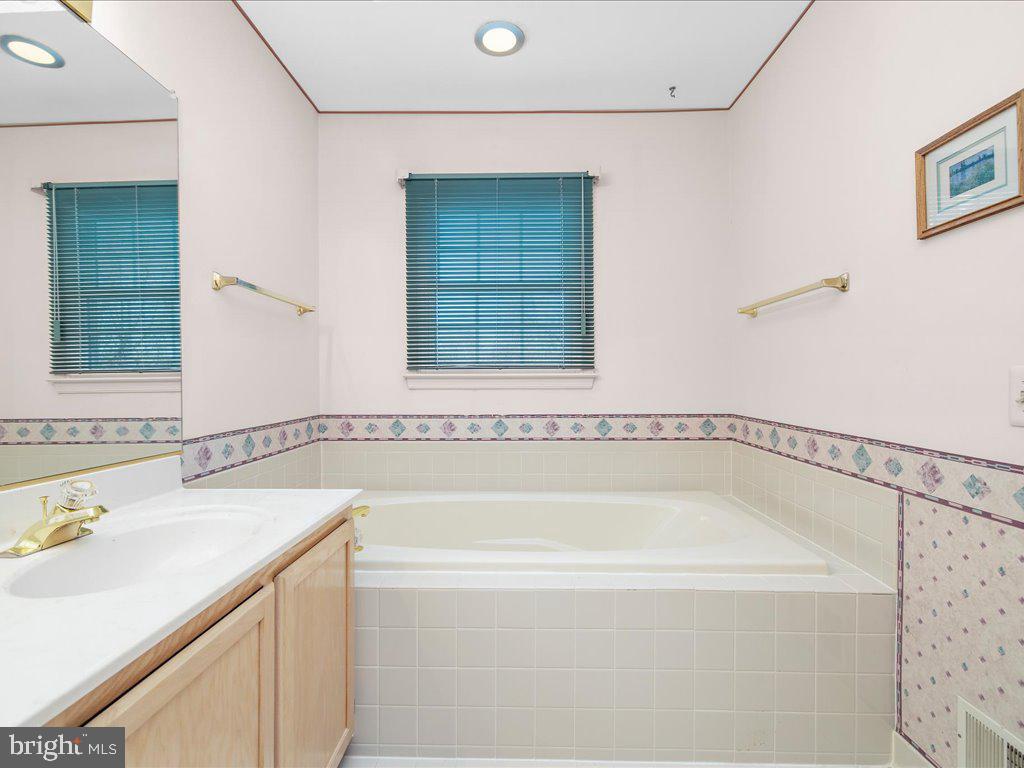 266 St Michaels Circle Odenton, MD 21113 - Photo 33 of 42 a white bath tub sitting next to a white sink