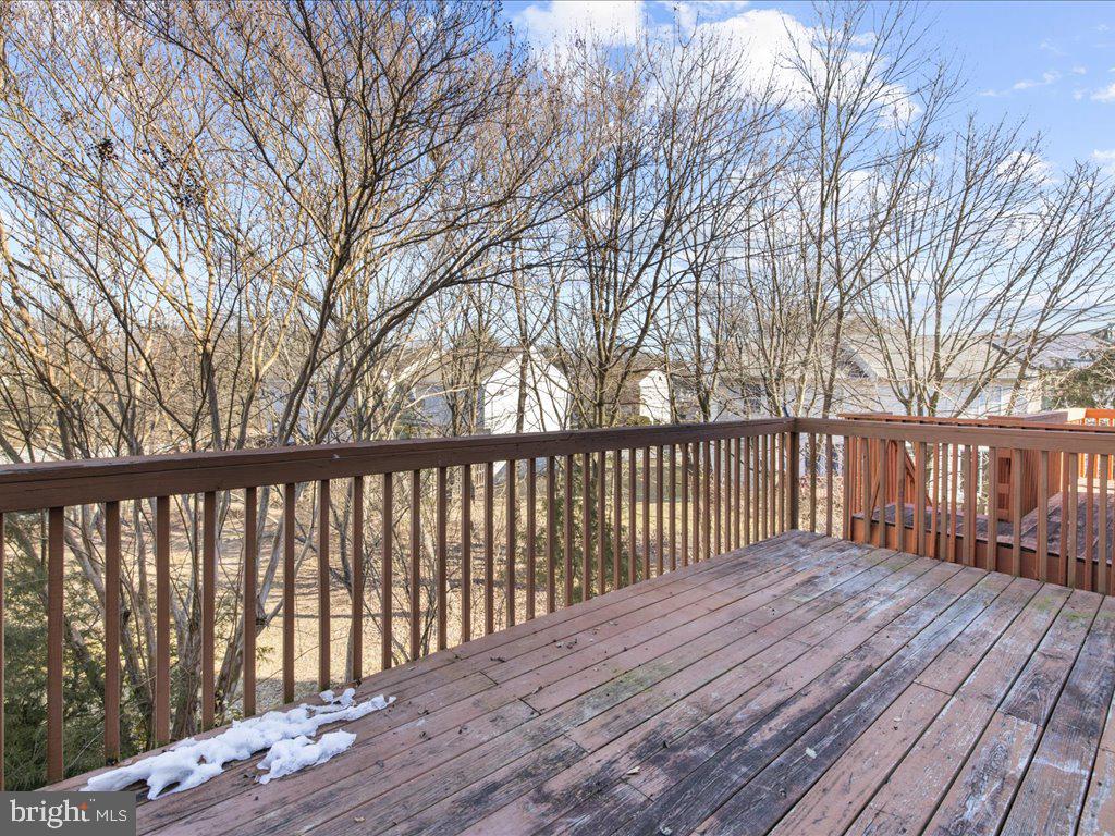266 St Michaels Circle Odenton, MD 21113 - Photo 37 of 42 a balcony with wooden floor and trees