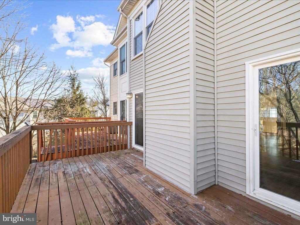 266 St Michaels Circle Odenton, MD 21113 - Photo 38 of 42 a view of a balcony with wooden floor