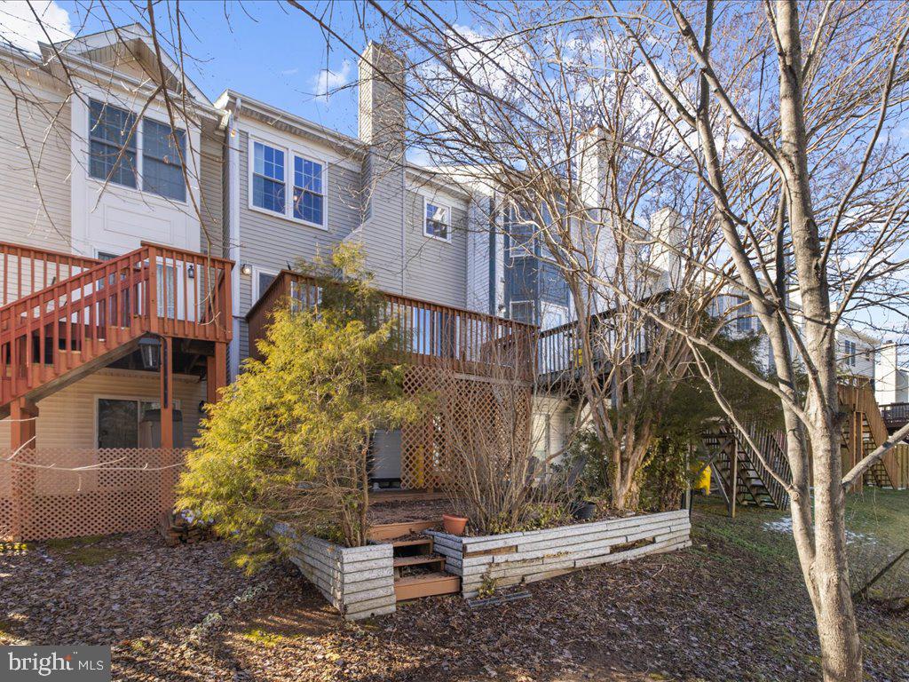 266 St Michaels Circle Odenton, MD 21113 - Photo 42 of 42 a view of backyard with large trees and wooden fence