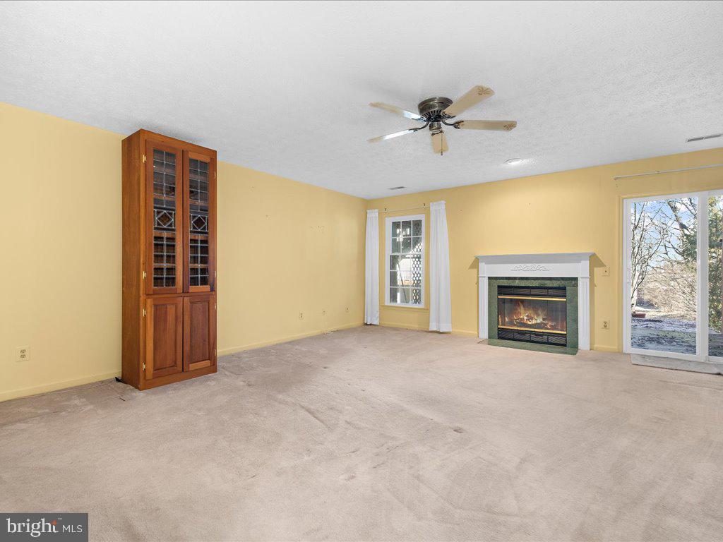 266 St Michaels Circle Odenton, MD 21113 - Photo 5 of 42 a view of an empty room with a fireplace