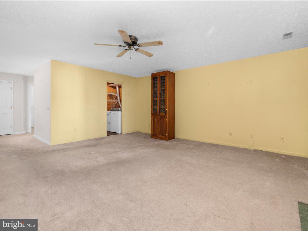 266 St Michaels Circle Odenton, MD 21113 - Photo 6 of 42 a view of a big room with closet and wooden floor